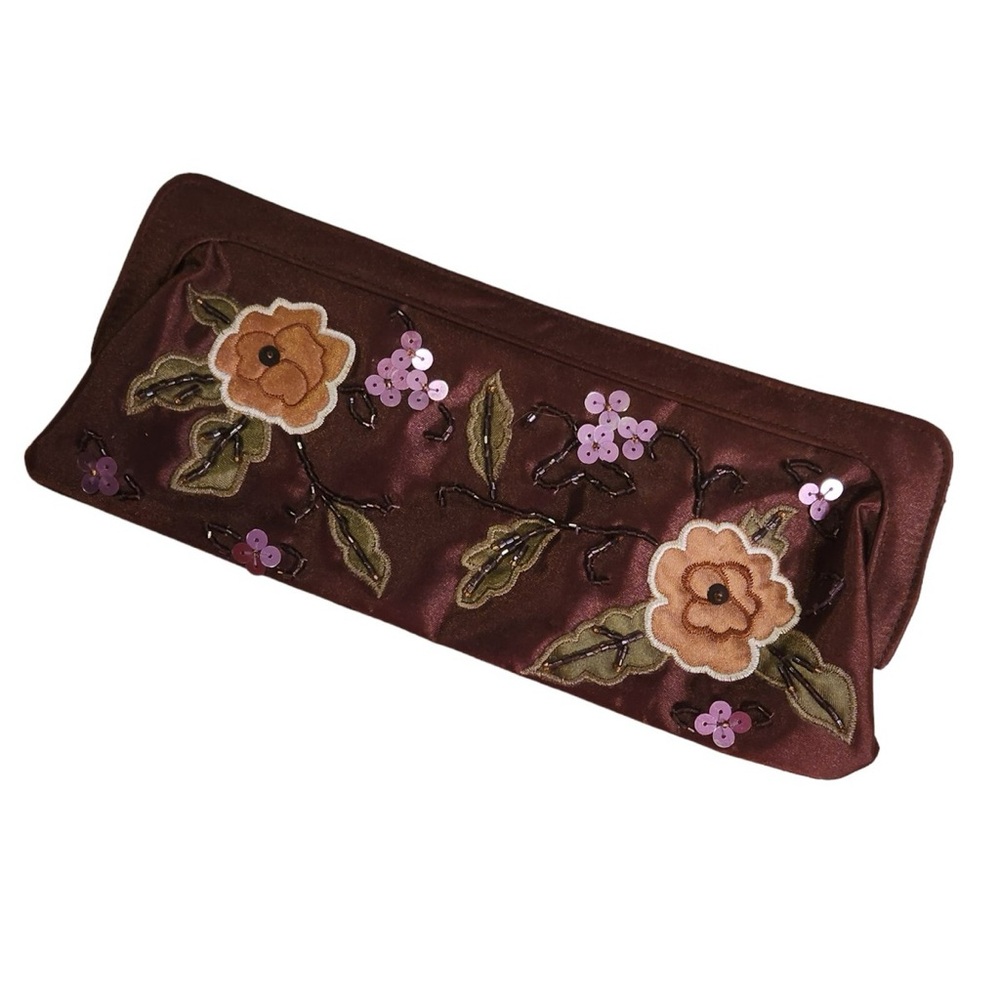 Avon vintage brown satin clutch features a floral design.